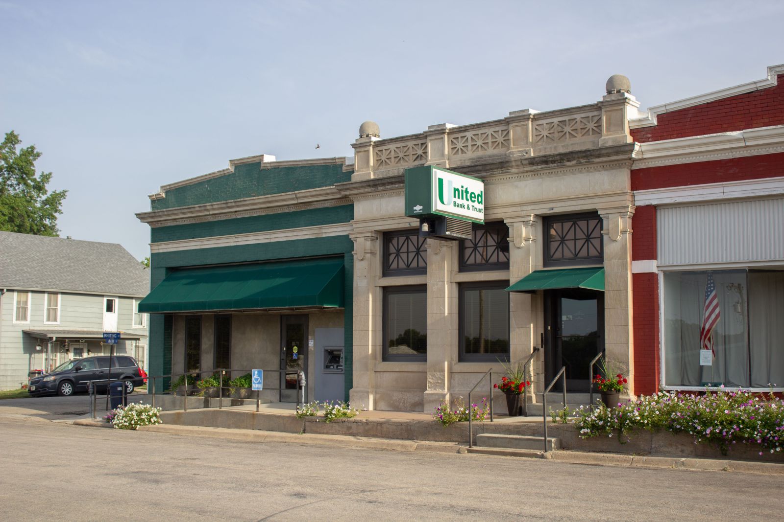 United Bank & Trust front of building with green awning and paint.